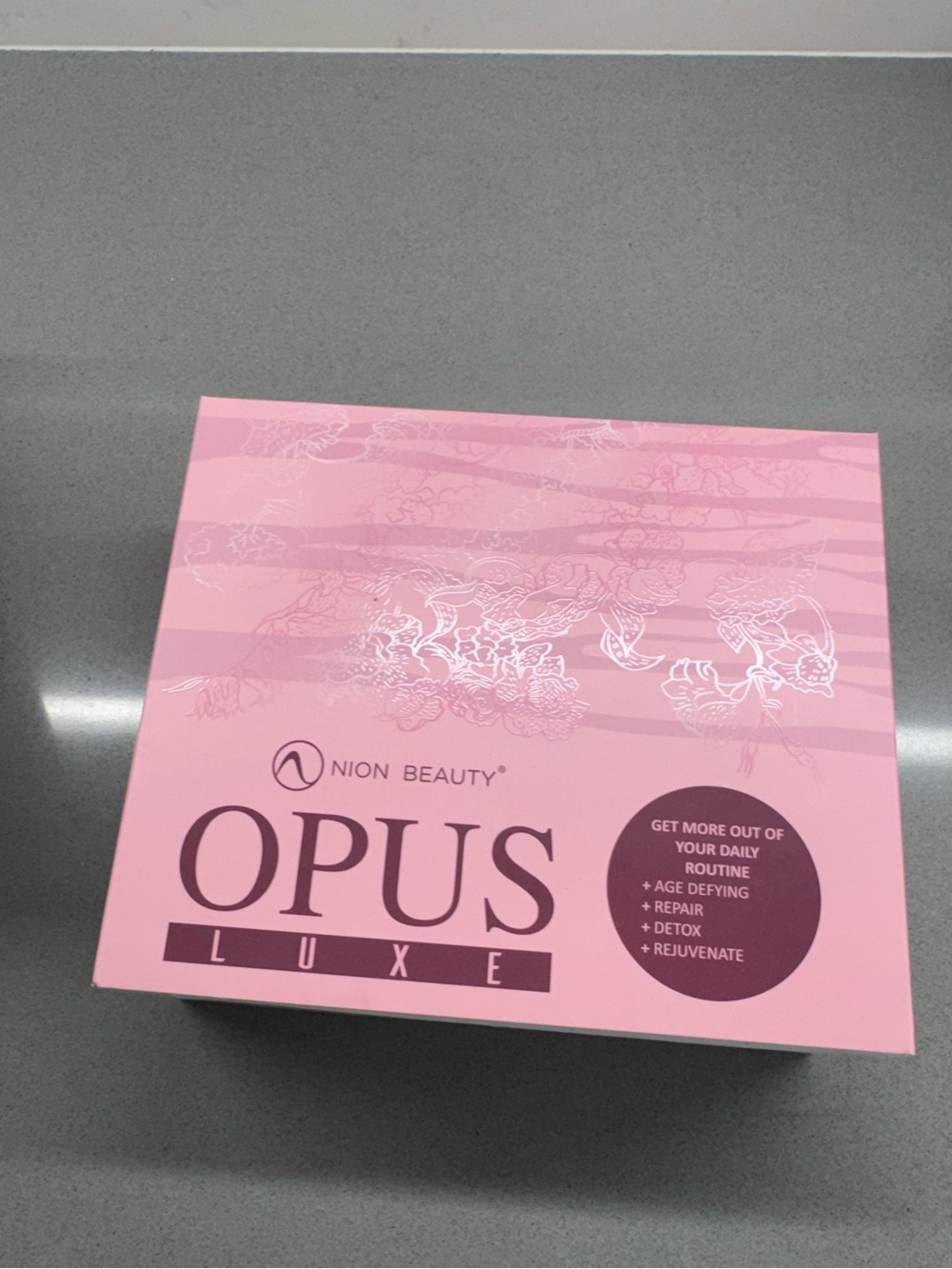 NION Beauty Opus Luxe sonic facial cleansing device in pink